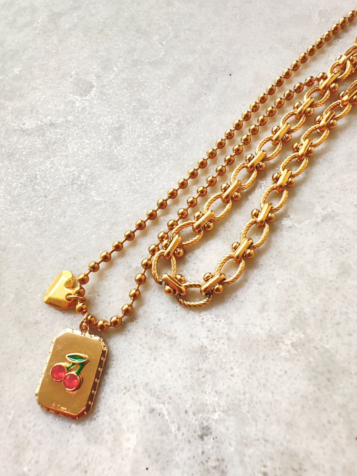 Pack: Collar Cherry + Cadena Óvalo Chico twist